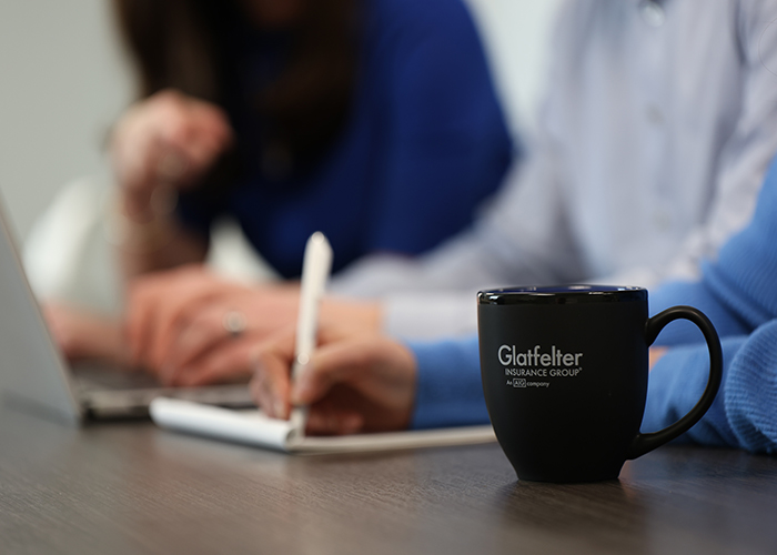 close up of Glatfelter coffee mug on conference table